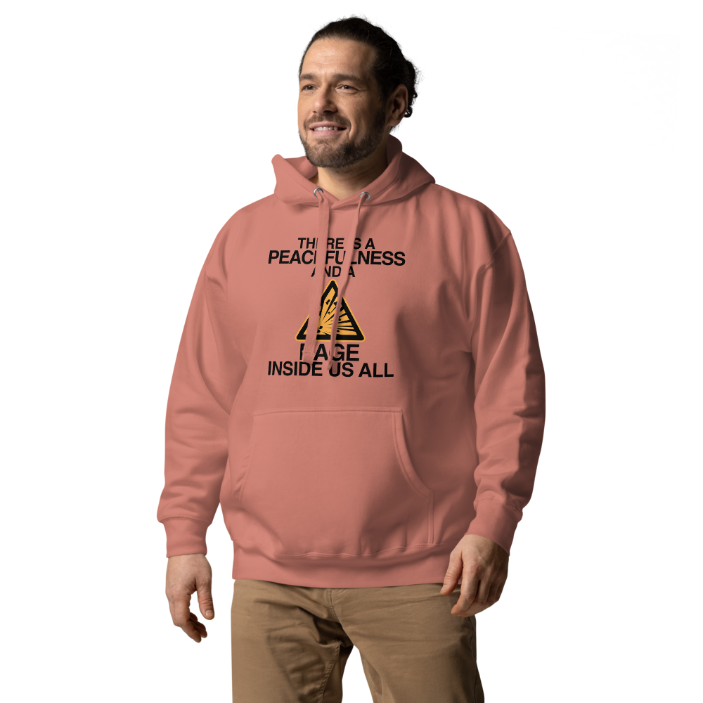 "There is a peacefulness and a rage inside us all" printed on a dusty rose unisex hoodie worn by a male