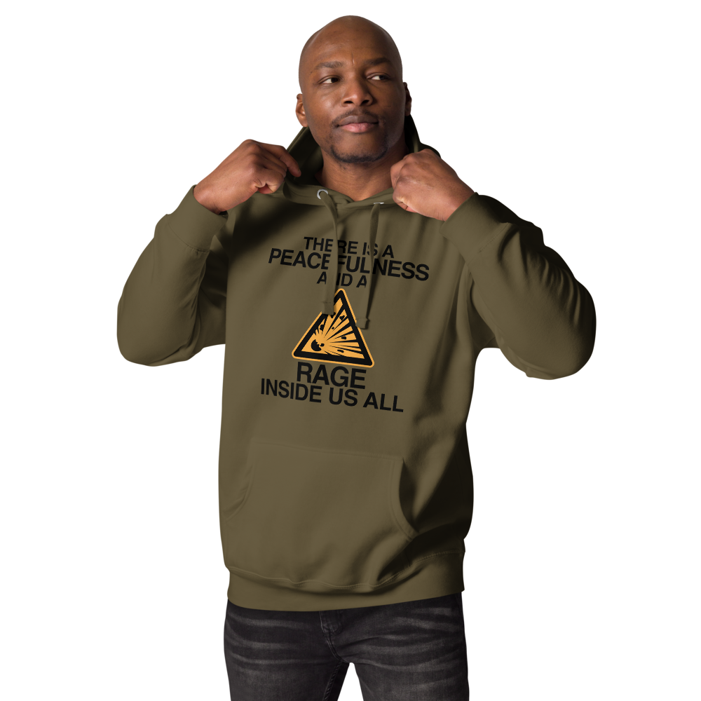 "There is a peacefulness and a rage inside us all" printed on a military green unisex hoodie worn by a male