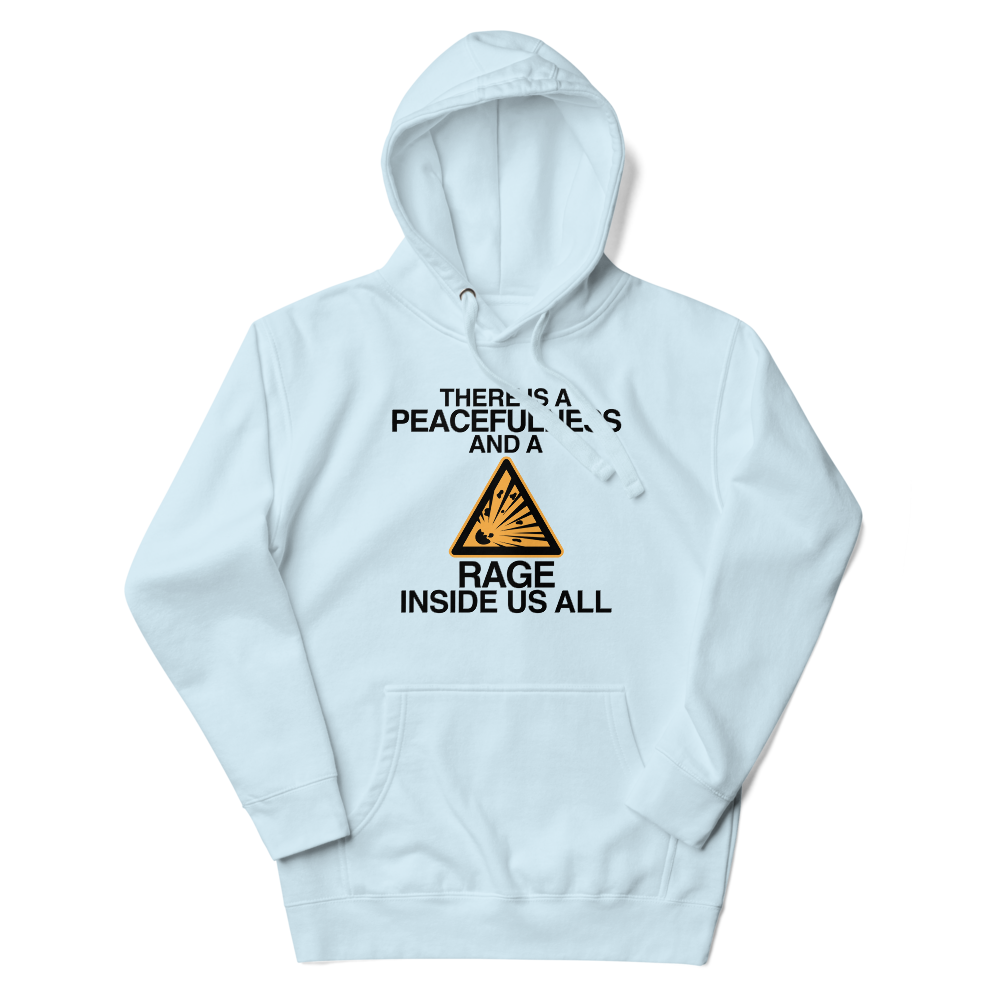 "There is a peacefulness and a rage inside us all" printed on a sky blue unisex hoodie laying on a flat surface with the hood up