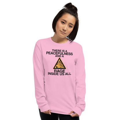 "There is a peacefulness and a rage inside us all" printed on a light pink men's long sleeve shirt worn by a female