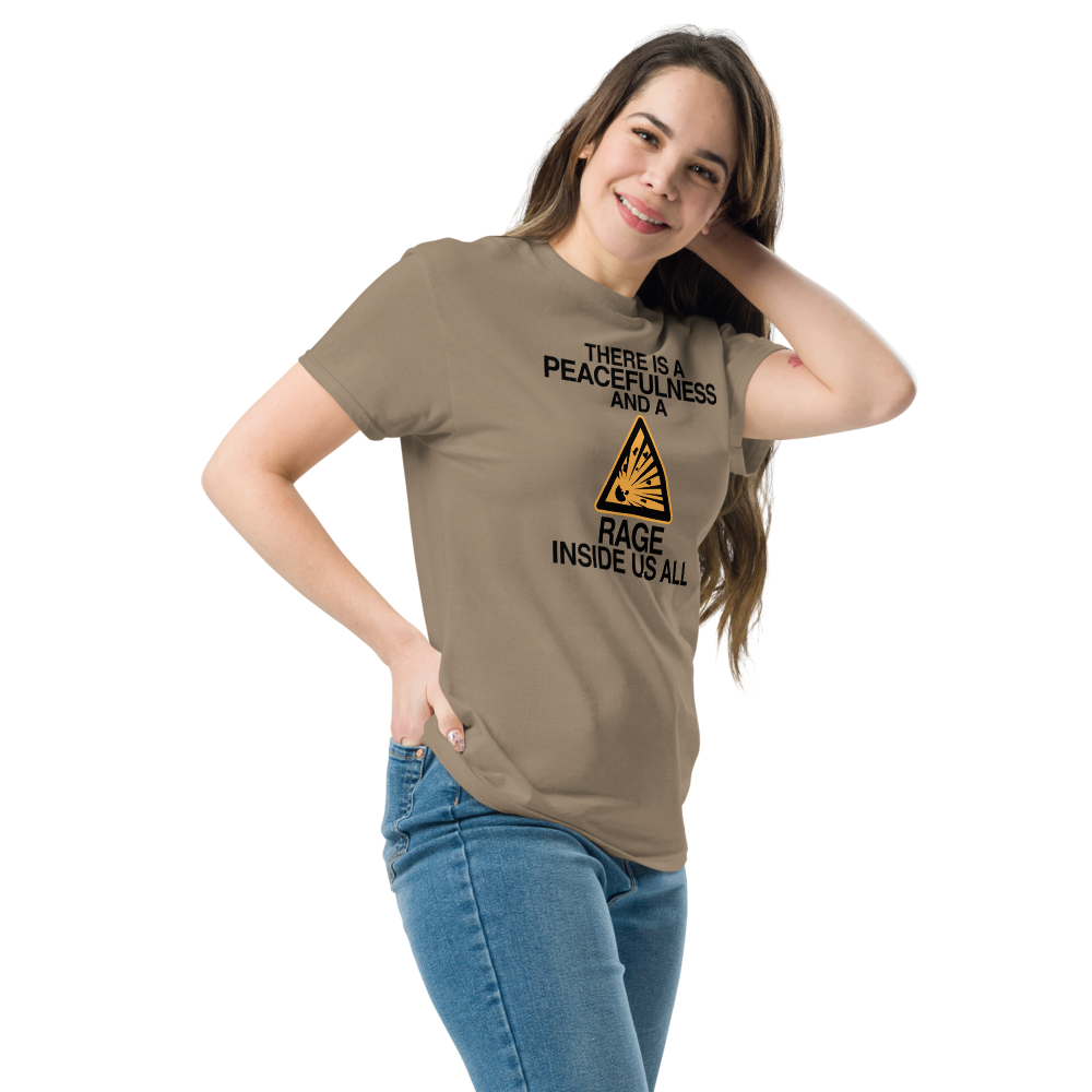 "There is a peacefulness and a rage inside us all" printed on a brown savana unisex classic tee worn by a female