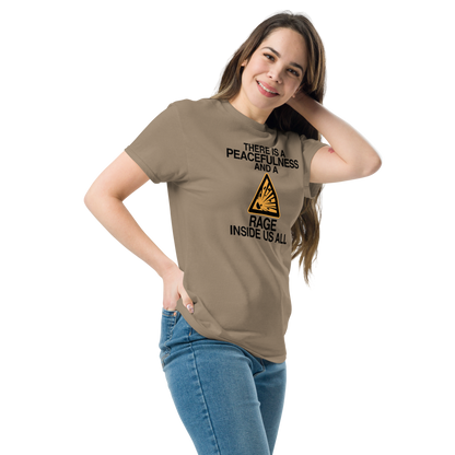 "There is a peacefulness and a rage inside us all" printed on a brown savana unisex classic tee worn by a female