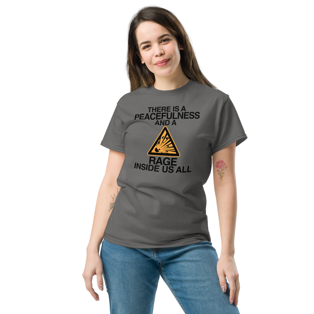 "There is a peacefulness and a rage inside us all" printed on a charcoal unisex classic tee worn by a female