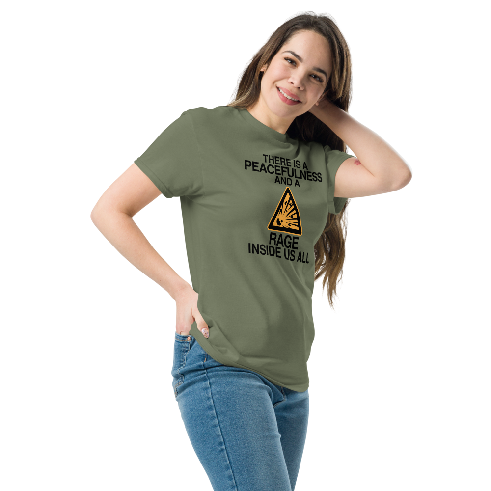 "There is a peacefulness and a rage inside us all" printed on a military green unisex classic tee worn by a female