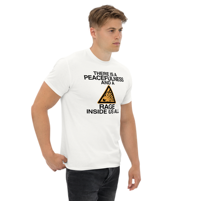 "There is a peacefulness and a rage inside us all" printed on a white unisex classic tee worn by a male