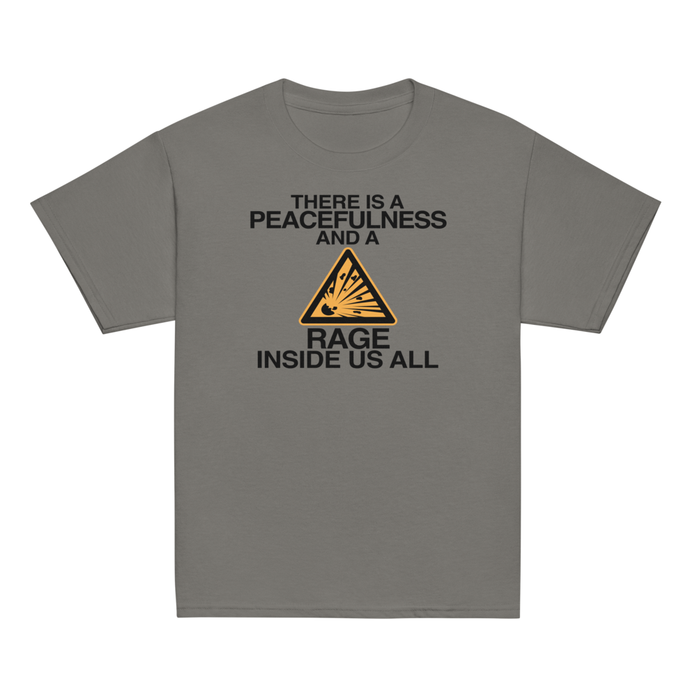 "There is a peacefulness and a rage inside us all" printed on a charcoal youth classic tee laying on a flat surface