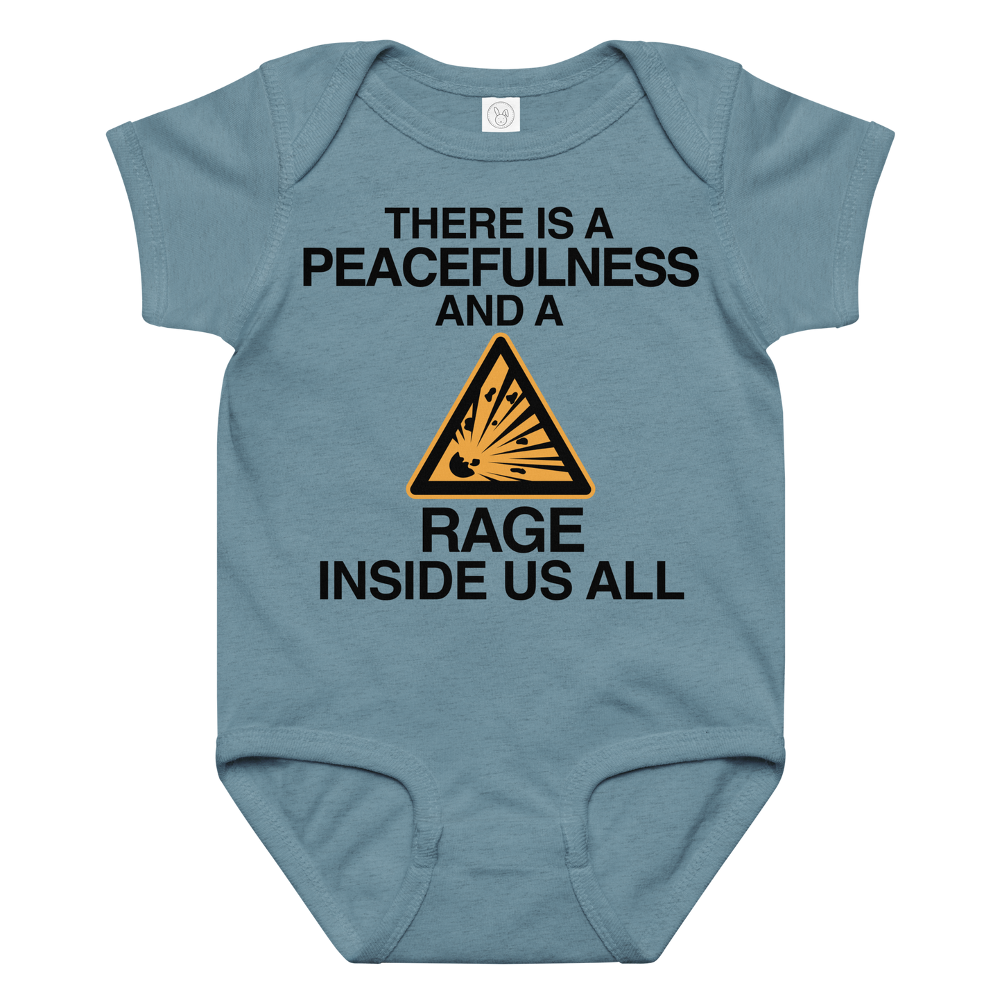 "There is a peacefulness and a rage inside us all" printed on a vintage indigo baby jersey bodysuit laying on a flat surface amongst other clothes