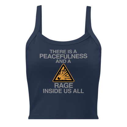 "There is a peacefulness and a rage inside us all" printed on a solid navy blend women's micro-rib tanktop laying on a flat surface