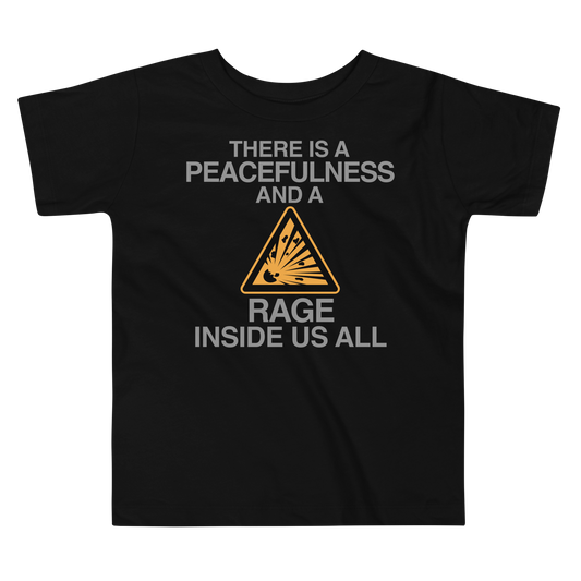 "There is a peacefulness and a rage inside us all" printed on a black toddler short sleeve tee laying on a flat surface