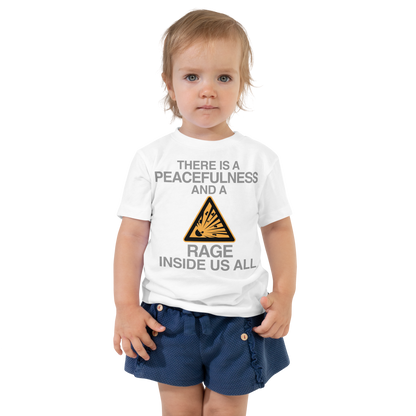 "There is a peacefulness and a rage inside us all" printed on a white toddler short sleeve tee worn by a female