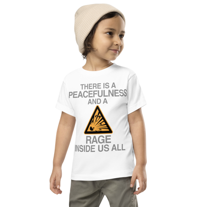 "There is a peacefulness and a rage inside us all" printed on a white toddler short sleeve tee worn by a male wearing a cap