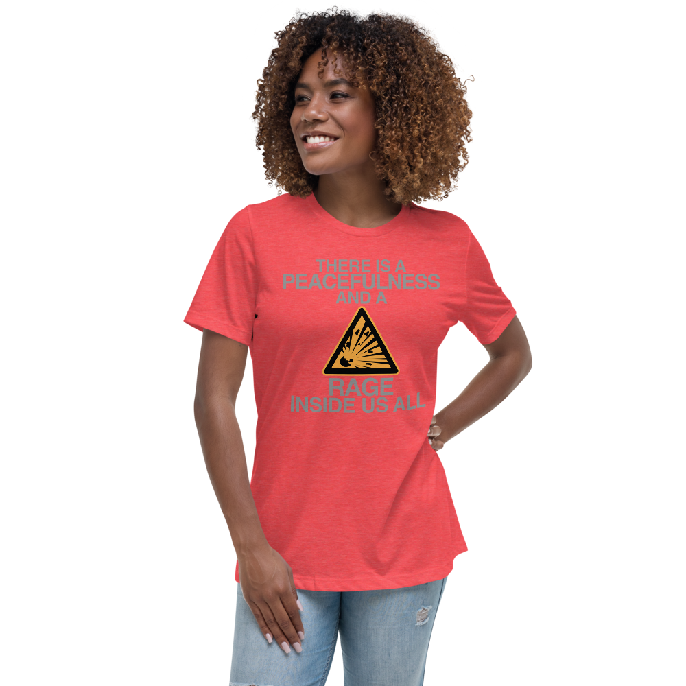 "There is a peacefulness and a rage inside us all" printed on a heather red women's relaxed t-shirt worn by a female