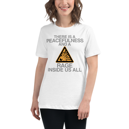 "There is a peacefulness and a rage inside us all" printed on a white women's relaxed t-shirt worn by a female