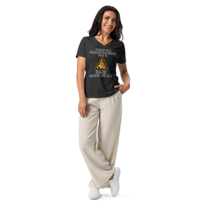"There is a peacefulness and a rage inside us all" printed on a dark grey heather women's relaxed v-neck t-shirt worn by a female