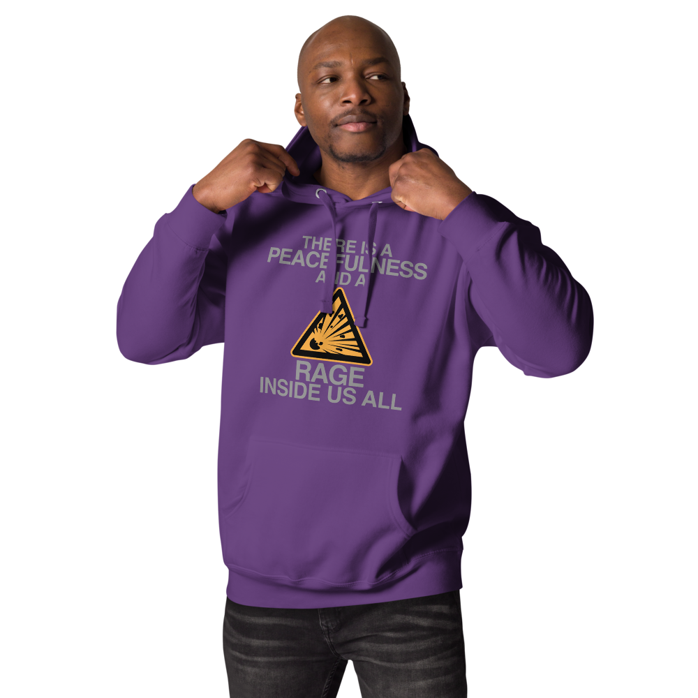 "There is a peacefulness and a rage inside us all" printed on a purple unisex hoodie worn by a male