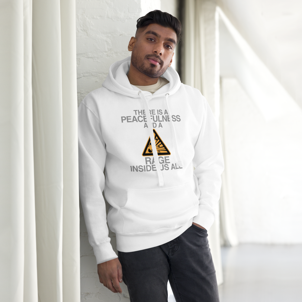 "There is a peacefulness and a rage inside us all" printed on a white unisex hoodie worn by a male