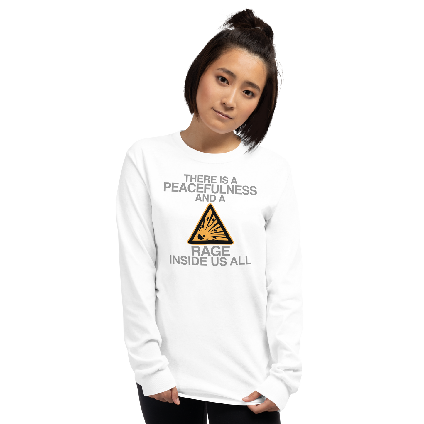 "There is a peacefulness and a rage inside us all" printed on a white men's long sleeve shirt worn by a female