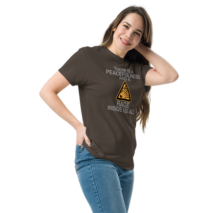 "There is a peacefulness and a rage inside us all" printed on a dark chocolate unisex classic tee worn by a female