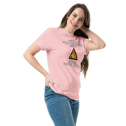 "There is a peacefulness and a rage inside us all" printed on a light pink unisex classic tee worn by a female