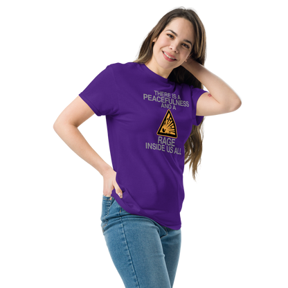 "There is a peacefulness and a rage inside us all" printed on a purple unisex classic tee worn by a female