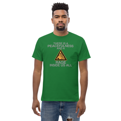 "There is a peacefulness and a rage inside us all" printed on a turf green unisex classic tee worn by a male