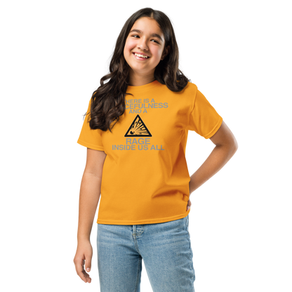 "There is a peacefulness and a rage inside us all" printed on a gold youth classic tee worn by a female