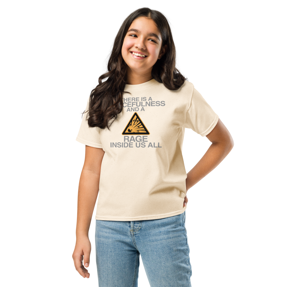 "There is a peacefulness and a rage inside us all" printed on a natural youth classic tee worn by a female