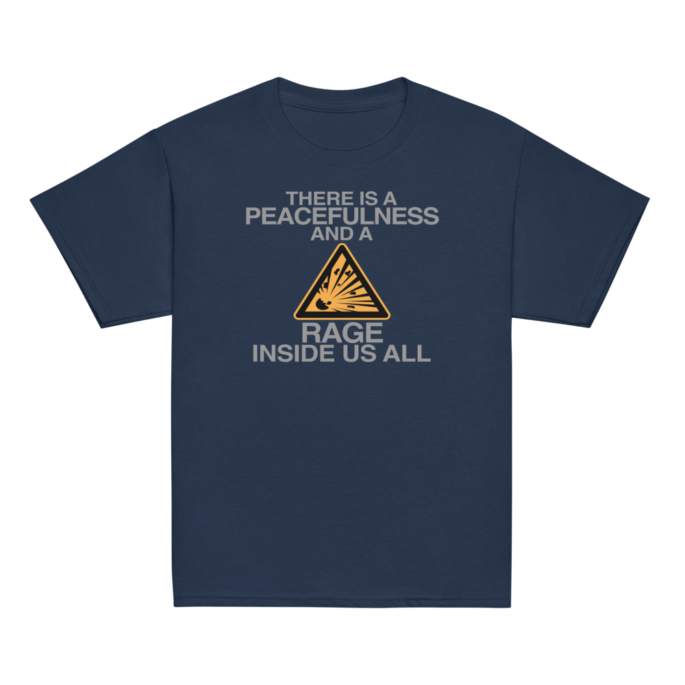 "There is a peacefulness and a rage inside us all" printed on a navy youth classic tee laying on a flat surface