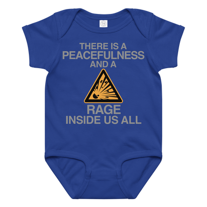 "There is a peacefulness and a rage inside us all" printed on a royal baby jersey bodysuit laying on a flat surface amongst other clothes