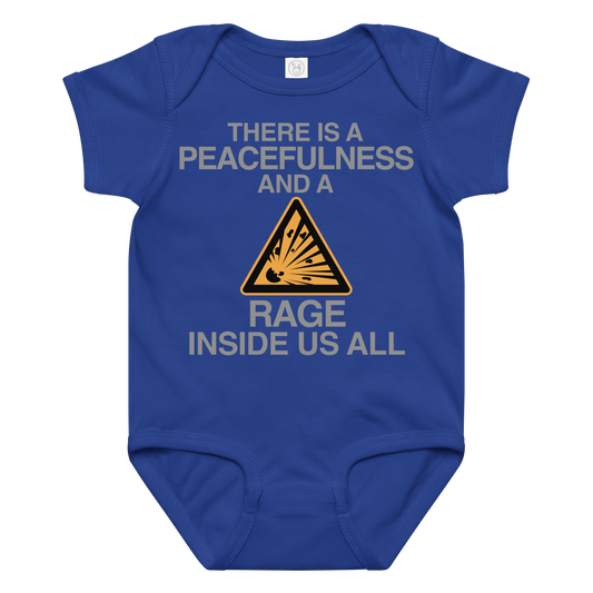 "There is a peacefulness and a rage inside us all" printed on a royal baby jersey bodysuit laying on a flat surface amongst other clothes