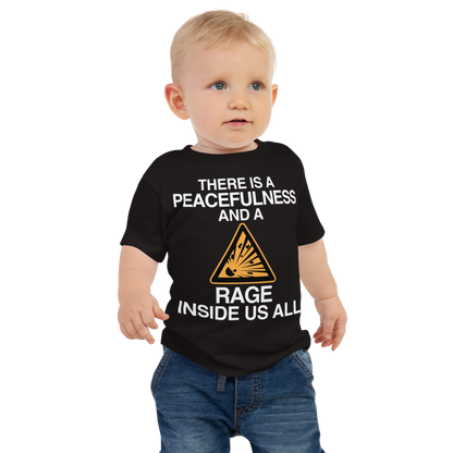 "There is a peacefulness and a rage inside us all" printed on a black baby jersey short sleeve tee worn by a male