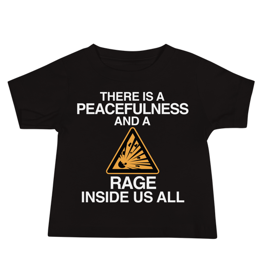 "There is a peacefulness and a rage inside us all" printed on a black baby jersey short sleeve tee laying on a flat surface