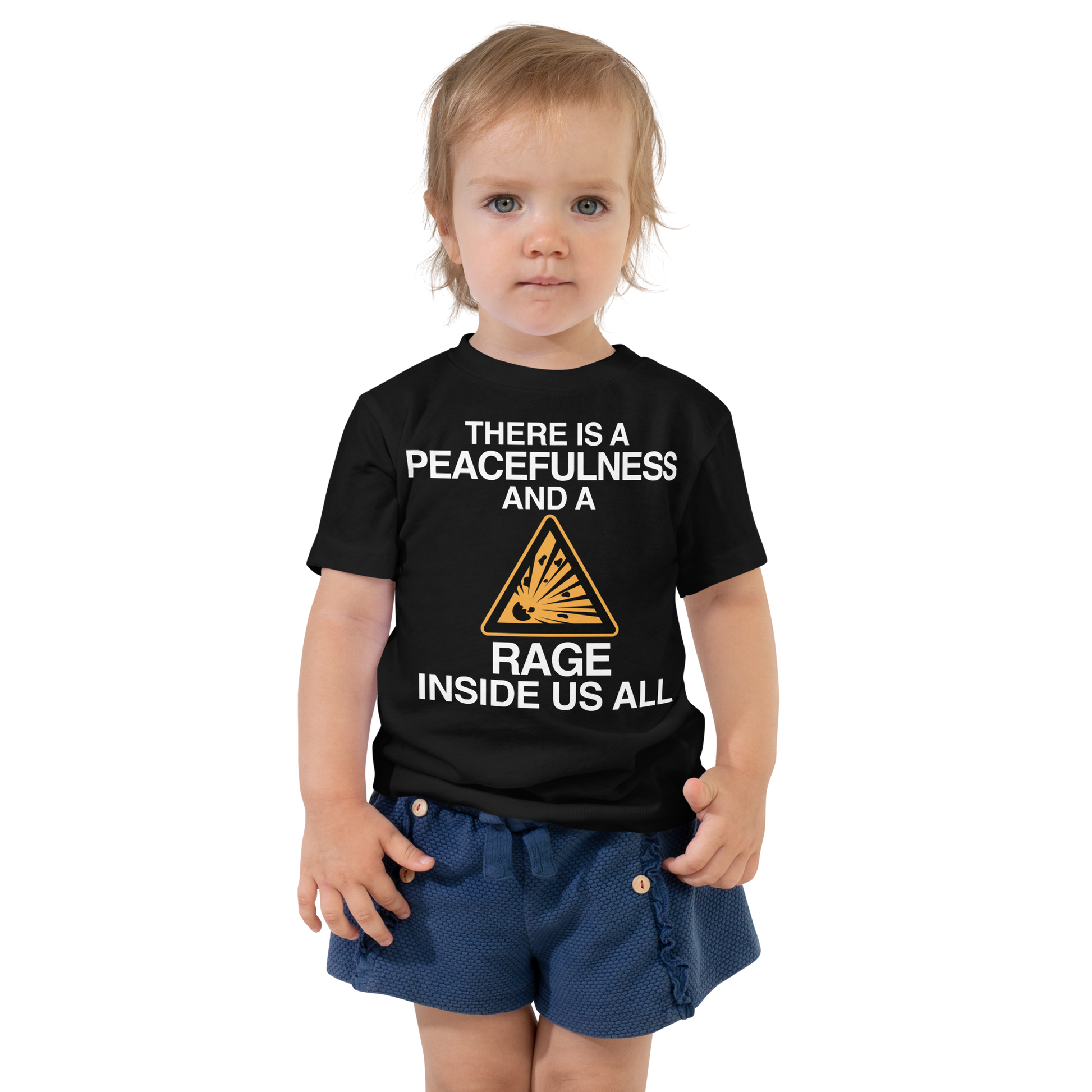"There is a peacefulness and a rage inside us all" printed on a black toddler short sleeve tee worn by a female