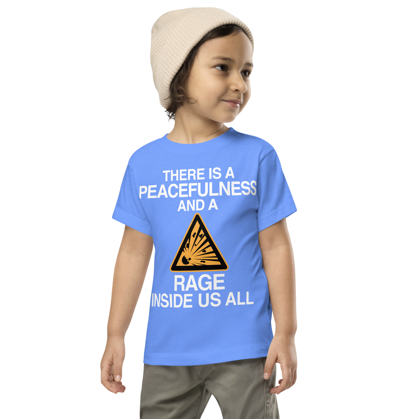 "There is a peacefulness and a rage inside us all" printed on a heather columbia blue toddler short sleeve tee worn by a male wearing a cap