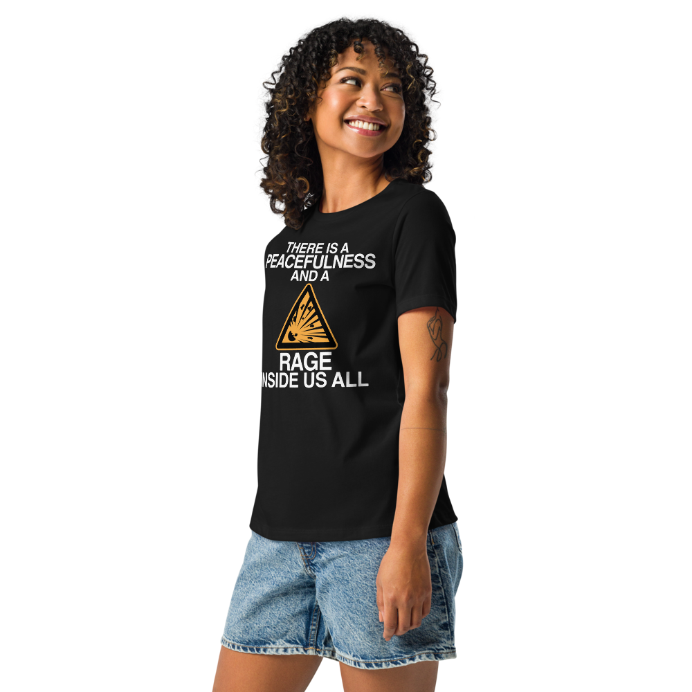 "There is a peacefulness and a rage inside us all" printed on a black women's relaxed t-shirt worn by a female