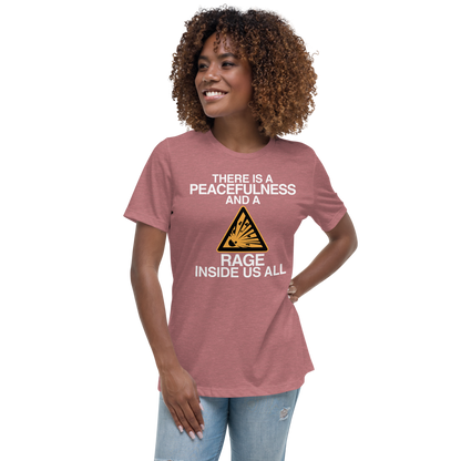 "There is a peacefulness and a rage inside us all" printed on a heather mauve women's relaxed t-shirt worn by a female