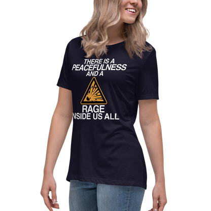 "There is a peacefulness and a rage inside us all" printed on a navy women's relaxed t-shirt worn by a female