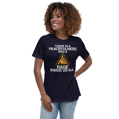 "There is a peacefulness and a rage inside us all" printed on a navy women's relaxed t-shirt worn by a female