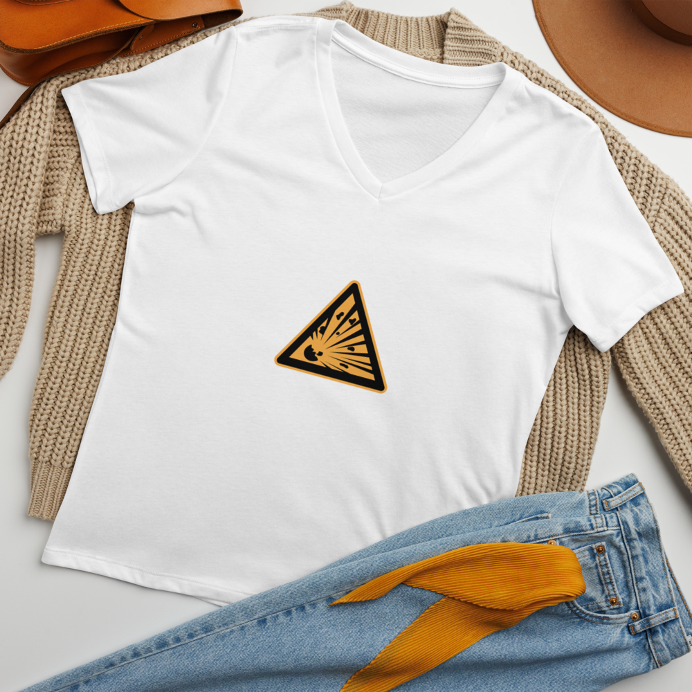 "There is a peacefulness and a rage inside us all" printed on a solid white blend women's relaxed v-neck t-shirt laying on a flat surface amongst other clothes