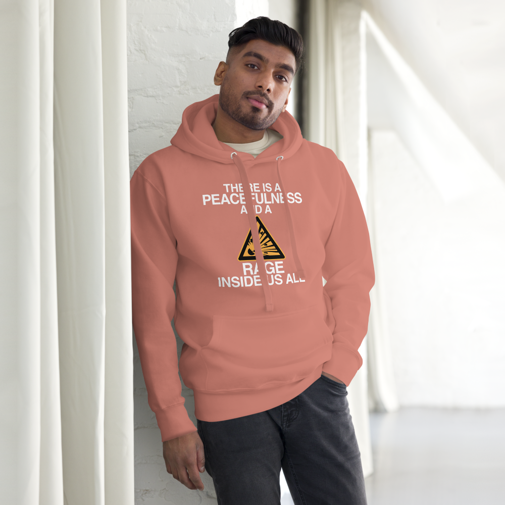 "There is a peacefulness and a rage inside us all" printed on a dusty rose unisex hoodie worn by a male