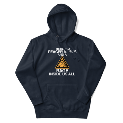 "There is a peacefulness and a rage inside us all" printed on a navy blazer unisex hoodie laying on a flat surface with the hood up