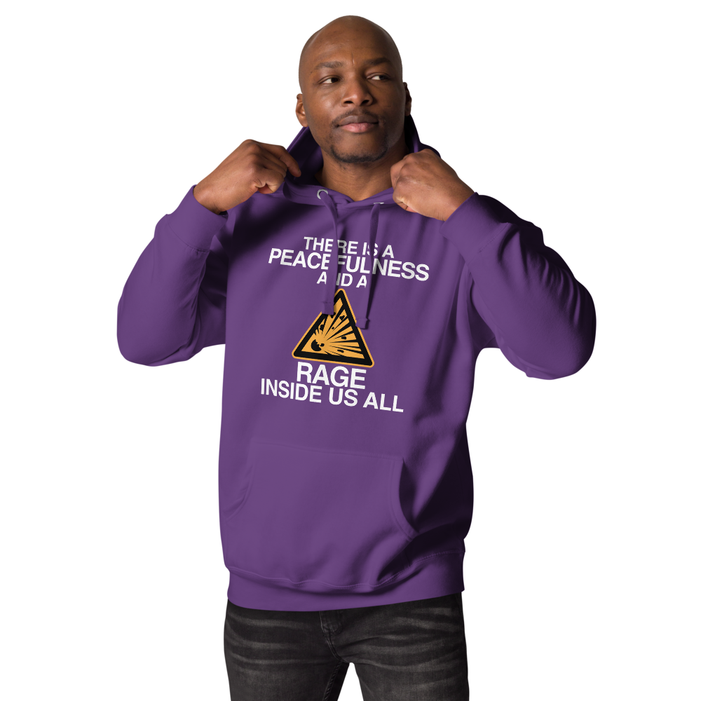 "There is a peacefulness and a rage inside us all" printed on a purple unisex hoodie worn by a male