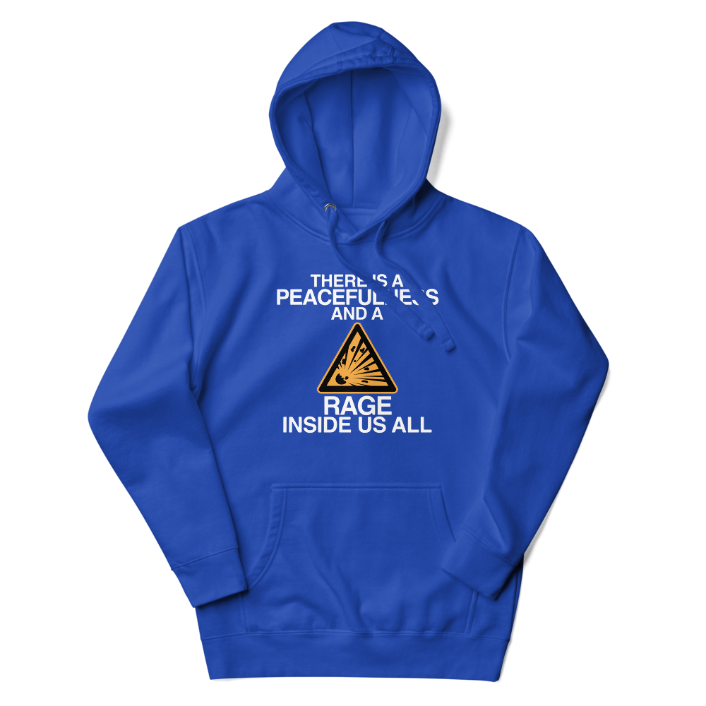 "There is a peacefulness and a rage inside us all" printed on a team royal unisex hoodie laying on a flat surface with the hood up