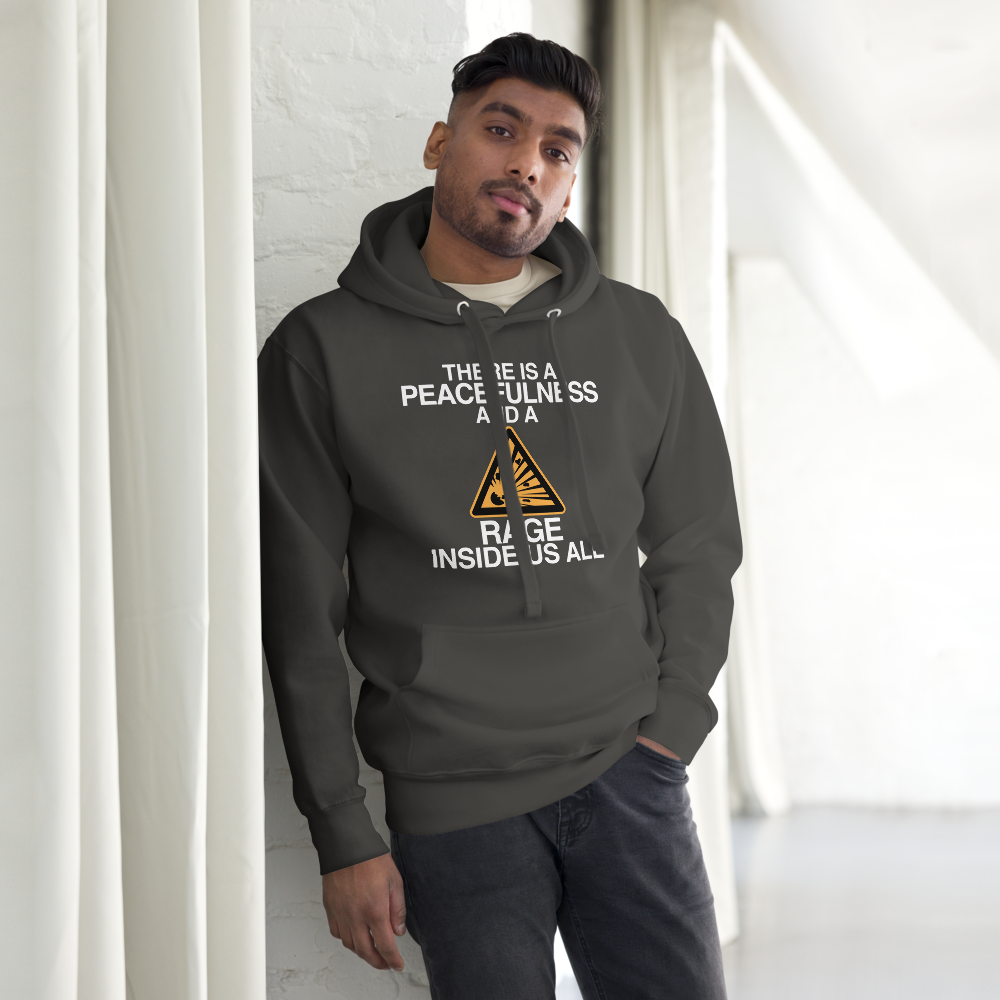 "There is a peacefulness and a rage inside us all" printed on a vintage black unisex hoodie worn by a male