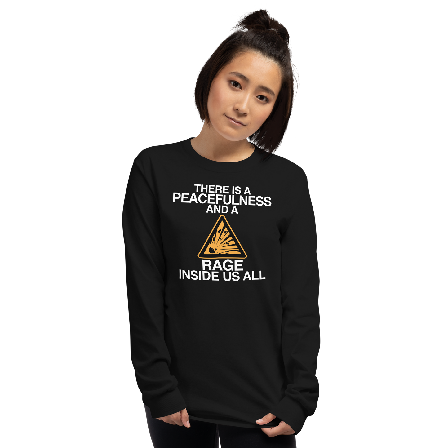 "There is a peacefulness and a rage inside us all" printed on a black men's long sleeve shirt worn by a female