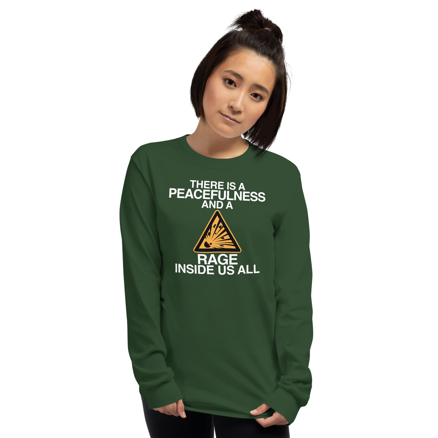 "There is a peacefulness and a rage inside us all" printed on a forest green men's long sleeve shirt worn by a female