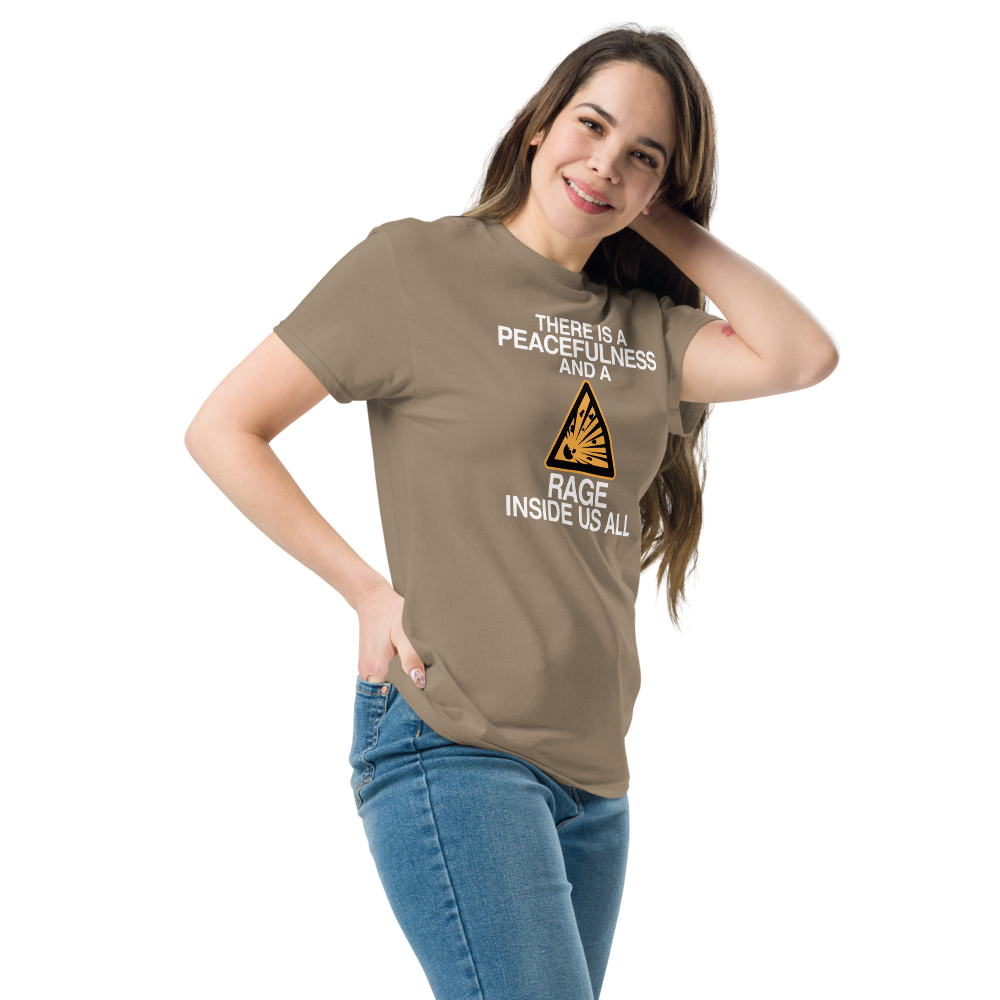 "There is a peacefulness and a rage inside us all" printed on a brown savana unisex classic tee worn by a female