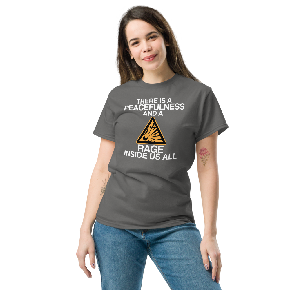"There is a peacefulness and a rage inside us all" printed on a charcoal unisex classic tee worn by a female