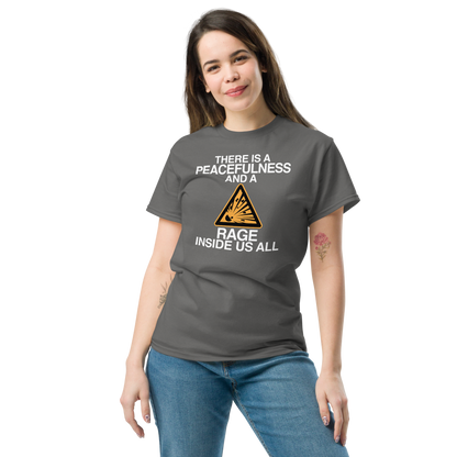 "There is a peacefulness and a rage inside us all" printed on a charcoal unisex classic tee worn by a female