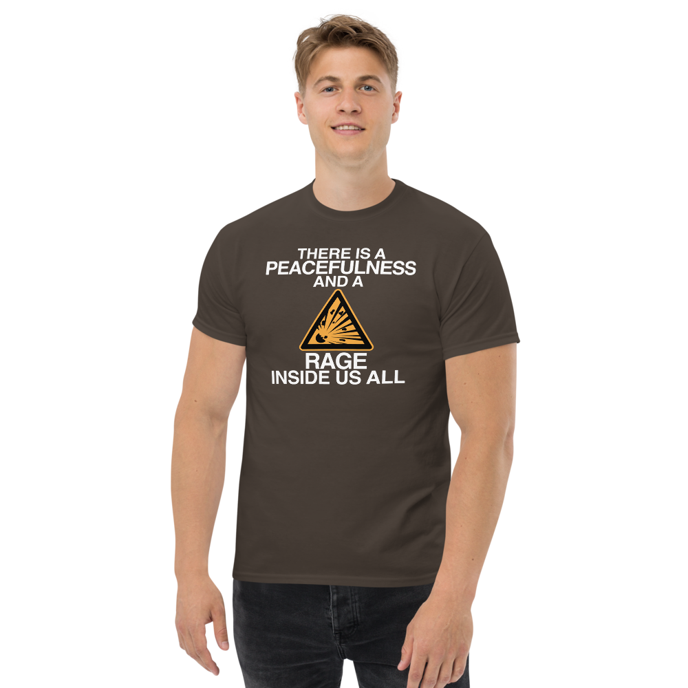 "There is a peacefulness and a rage inside us all" printed on a dark chocolate unisex classic tee worn by a male